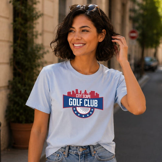 Light blue t-shirt with "Cityscape Golf Club" logo featuring a skyline and golf ball.