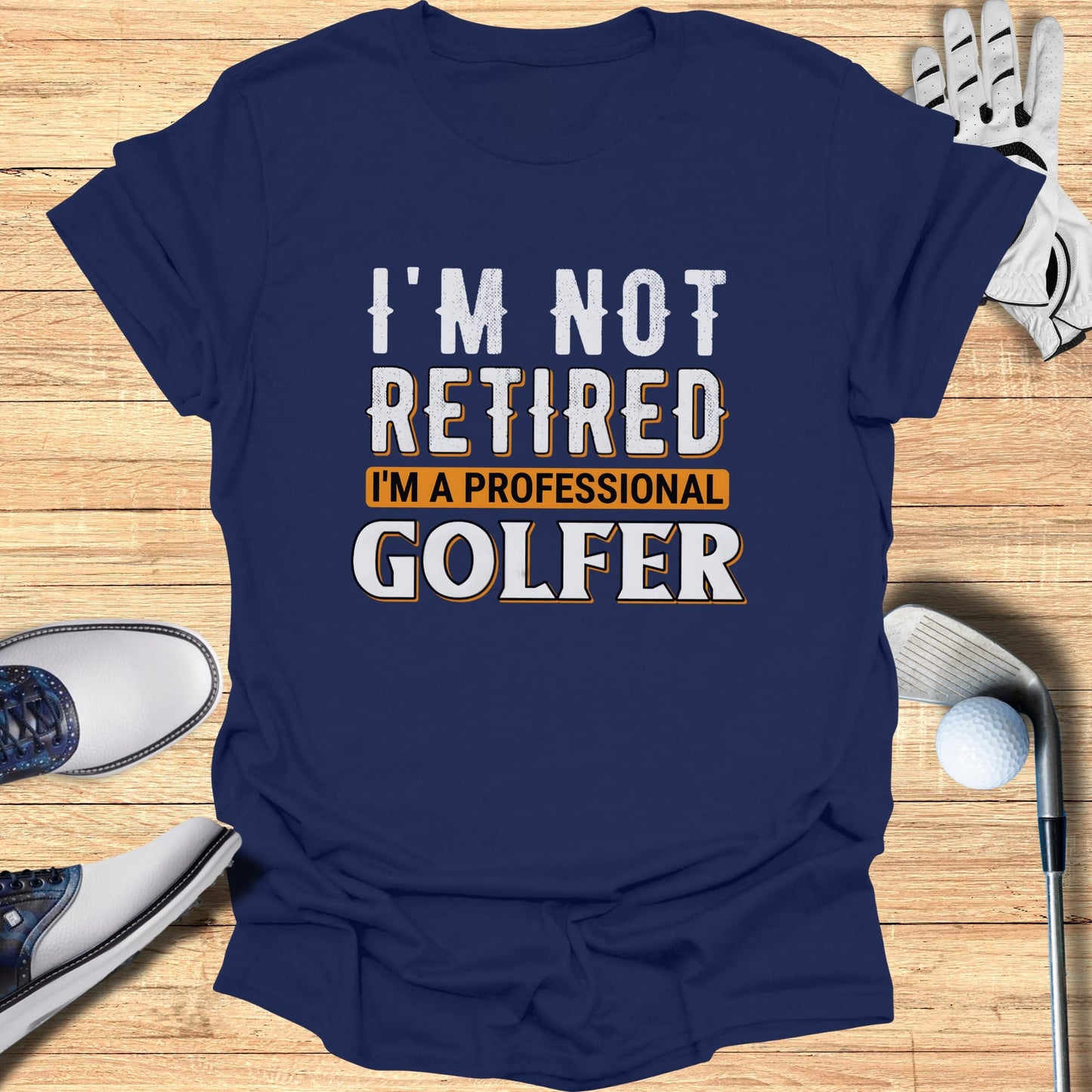 Navy t-shirt with "I'm not retired I'm a professional golfer" text.