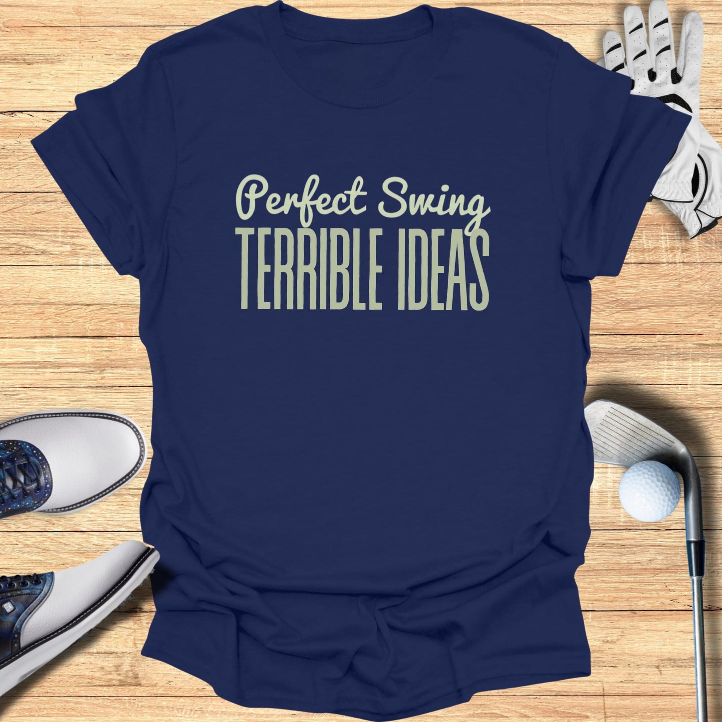 Navy t-shirt with "Perfect Swing TERRIBLE IDEAS" text in pale green.