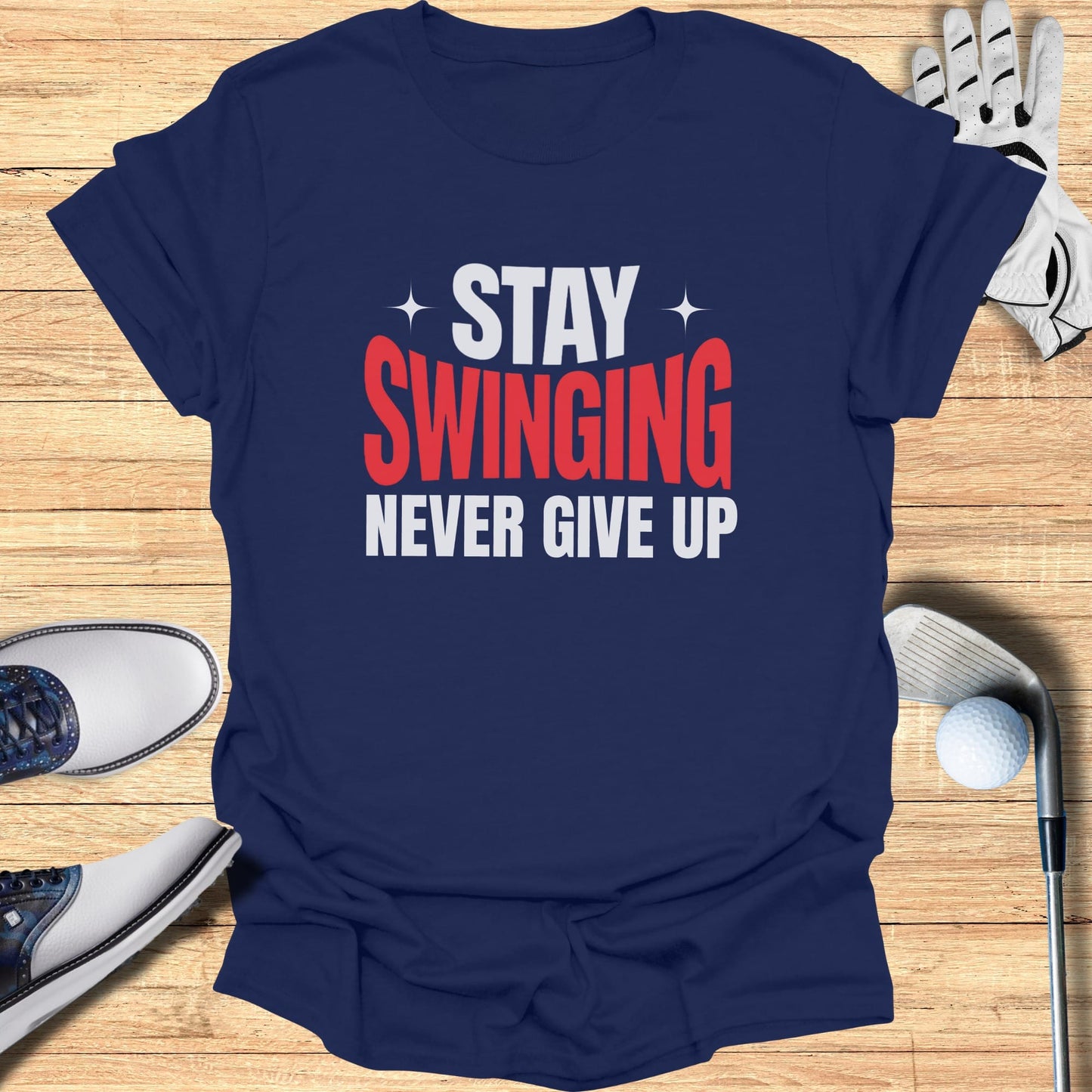 Navy t-shirt with "Stay Swinging Never Give Up" text in white and red.