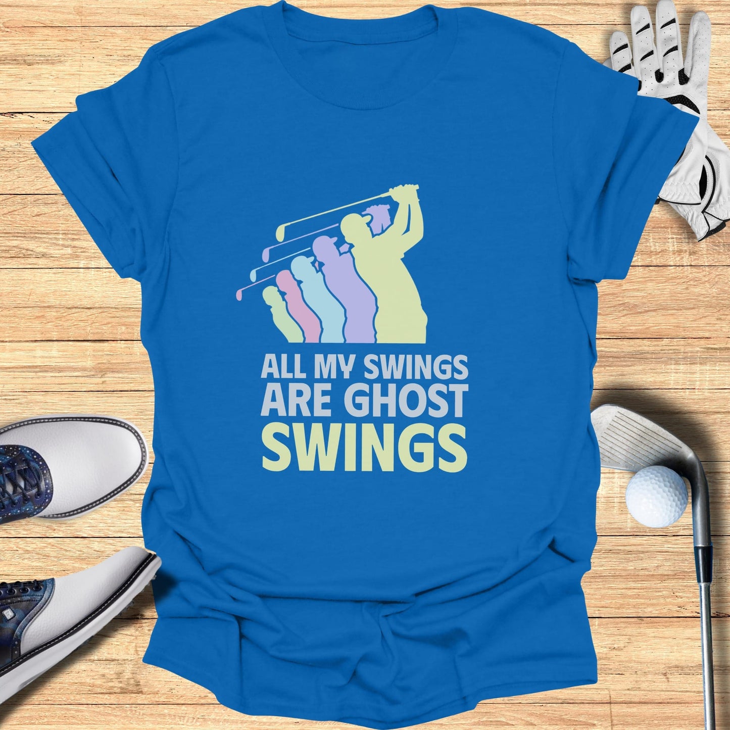 Blue t-shirt with "ALL MY SWINGS ARE GHOST SWINGS" text and golf graphic.