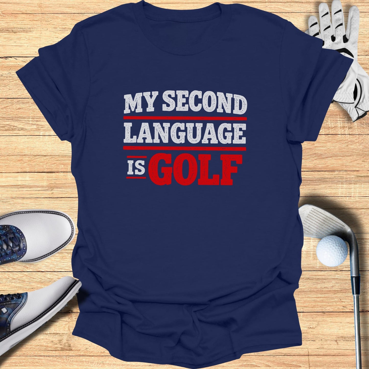 Navy t-shirt with "MY SECOND LANGUAGE IS GOLF" text.