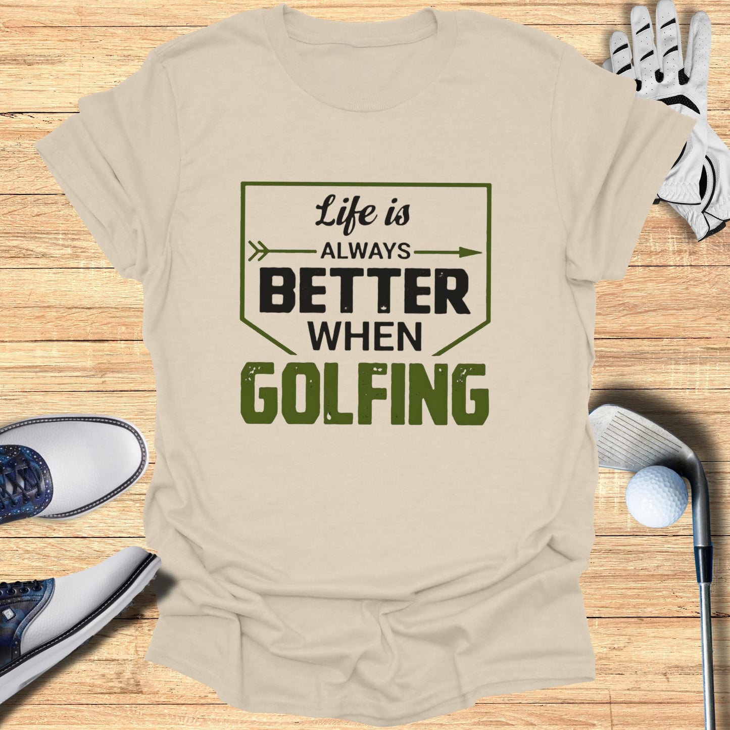 T-shirt with "Life is ALWAYS Better When GOLFING" text, golf clubs, ball, and shoes.