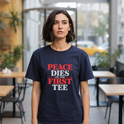 Woman wearing navy t-shirt with red and white text reading "PEACE DIES ON THE FIRST TEE".