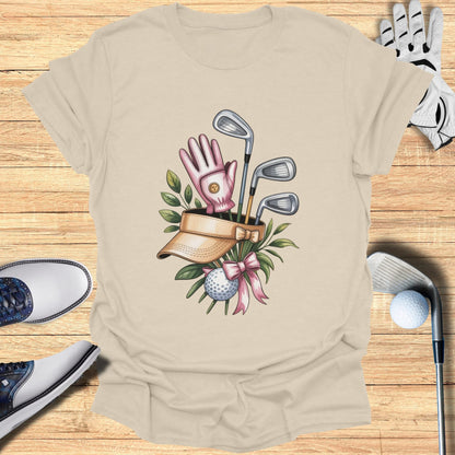 Golf gloves, clubs, ball, visor, and shoes on a wooden background.