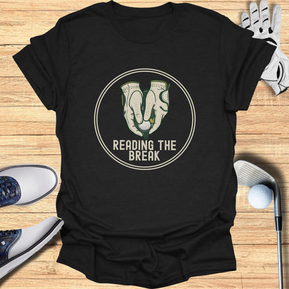 Black t-shirt with "READING THE BREAK" text and golf graphic.