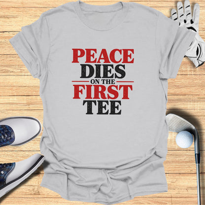 Grey t-shirt with "Peace Dies On The First Tee" text in red and black.