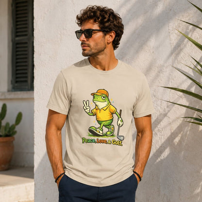 Man wearing a tan t-shirt with a cartoon frog golfer giving a peace sign.