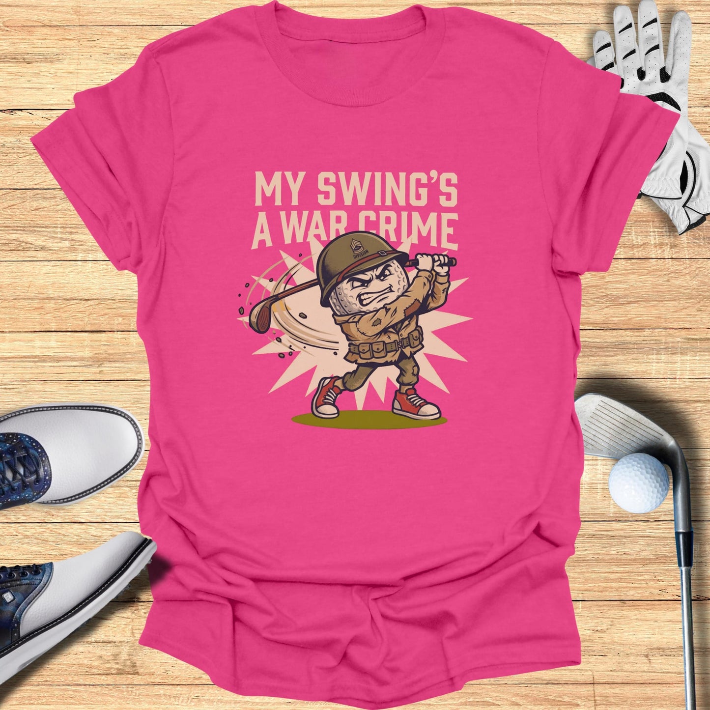 T-shirt with cartoon soldier swinging golf club, text "MY SWING'S A WAR CRIME".