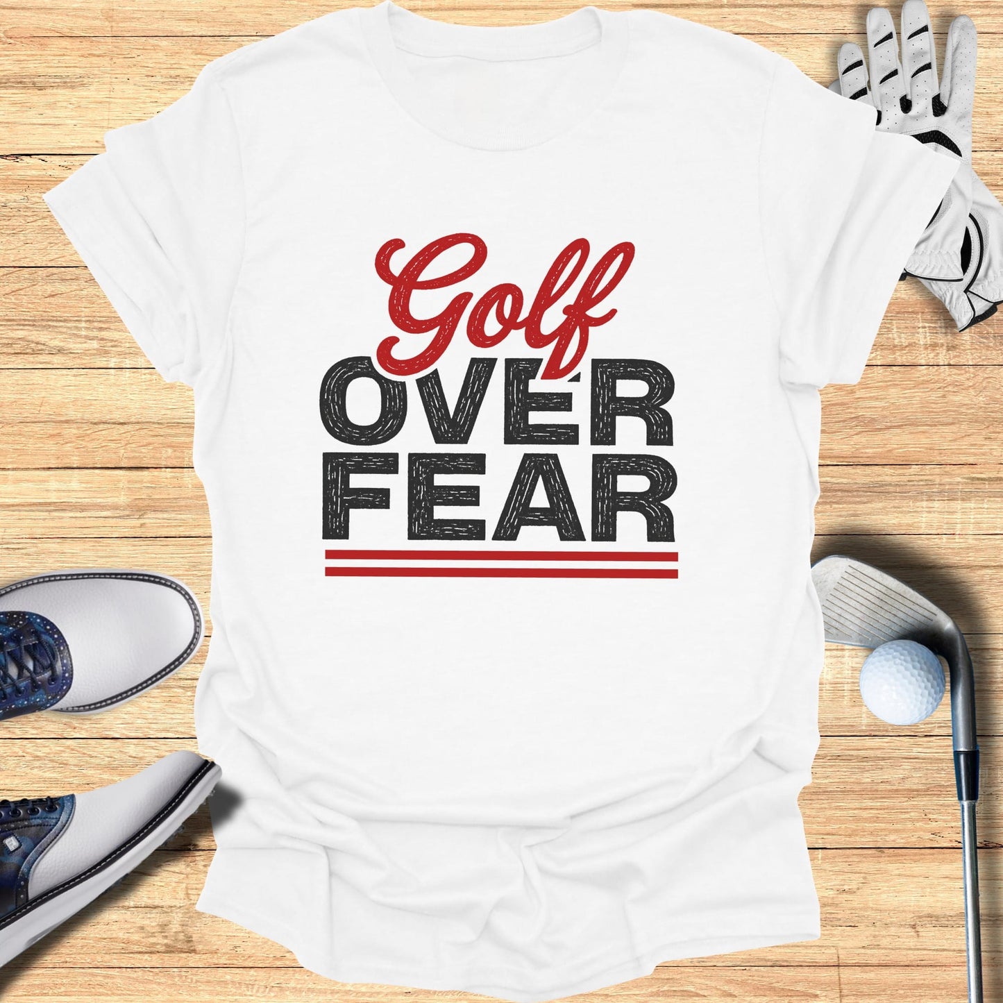 White t-shirt with "Golf Over Fear" text in red and black.