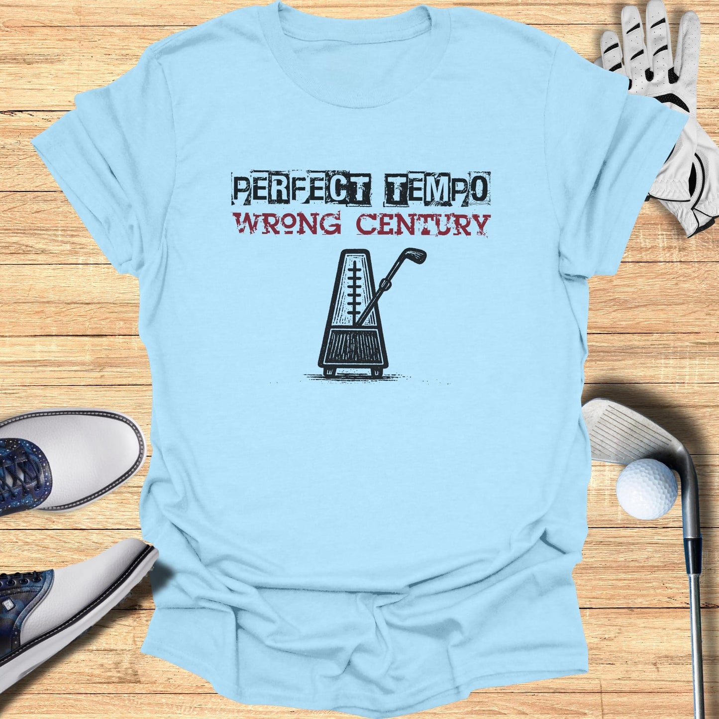 Light blue t-shirt with "PERFECT TEMPO WRONG CENTURY" text and metronome graphic.