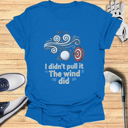 Blue t-shirt with "I didn't pull it The wind did" text and golf imagery.
