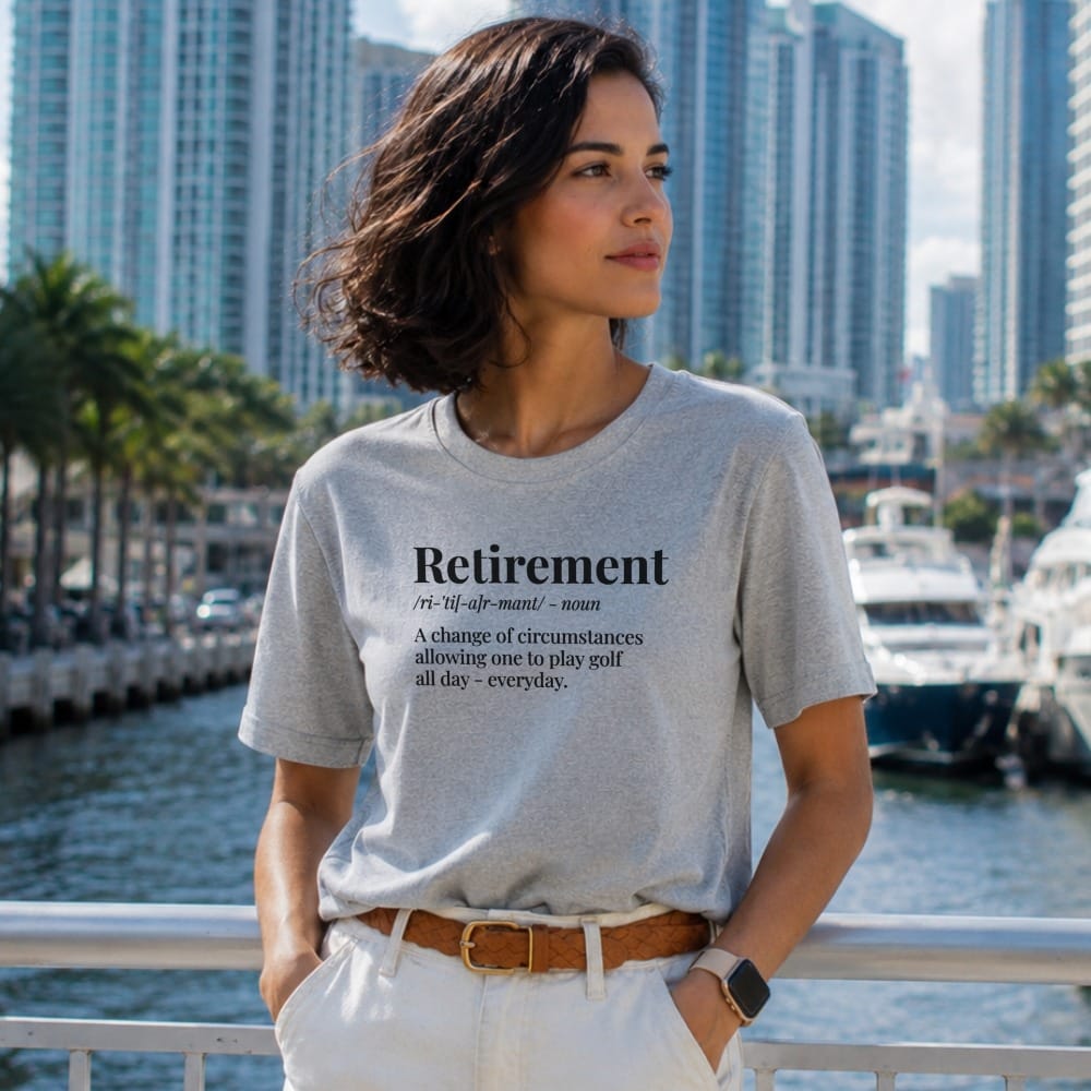 Woman wearing a gray t-shirt with "Retirement" definition.