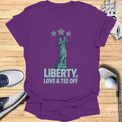 Statue of Liberty graphic with golf clubs, ball, and "Liberty, Love & Tee Off" text.