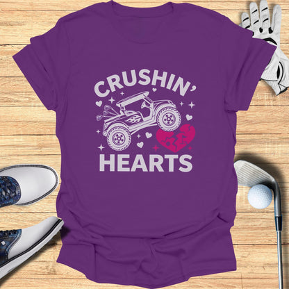 Purple t-shirt with "CRUSHIN' HEARTS" text and a broken heart graphic.