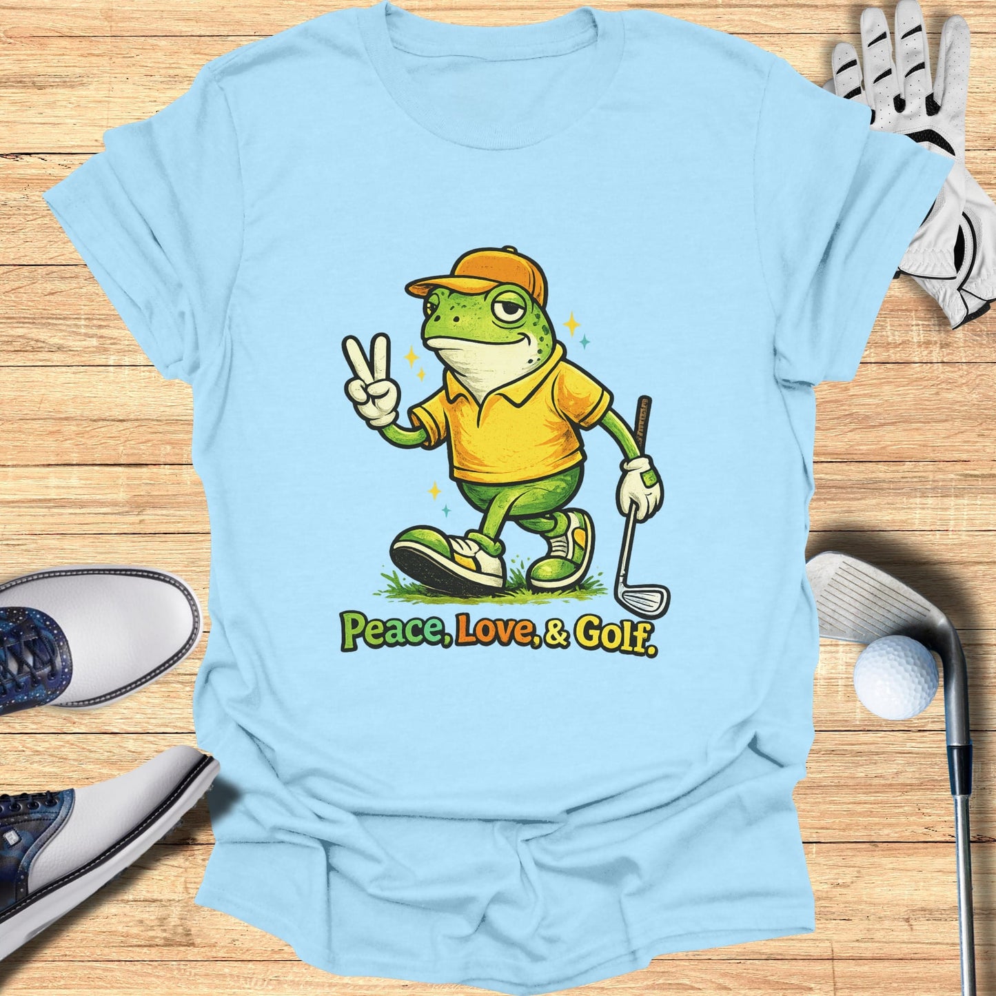 Cartoon frog in golf attire giving peace sign with "Peace, Love, & Golf" text.