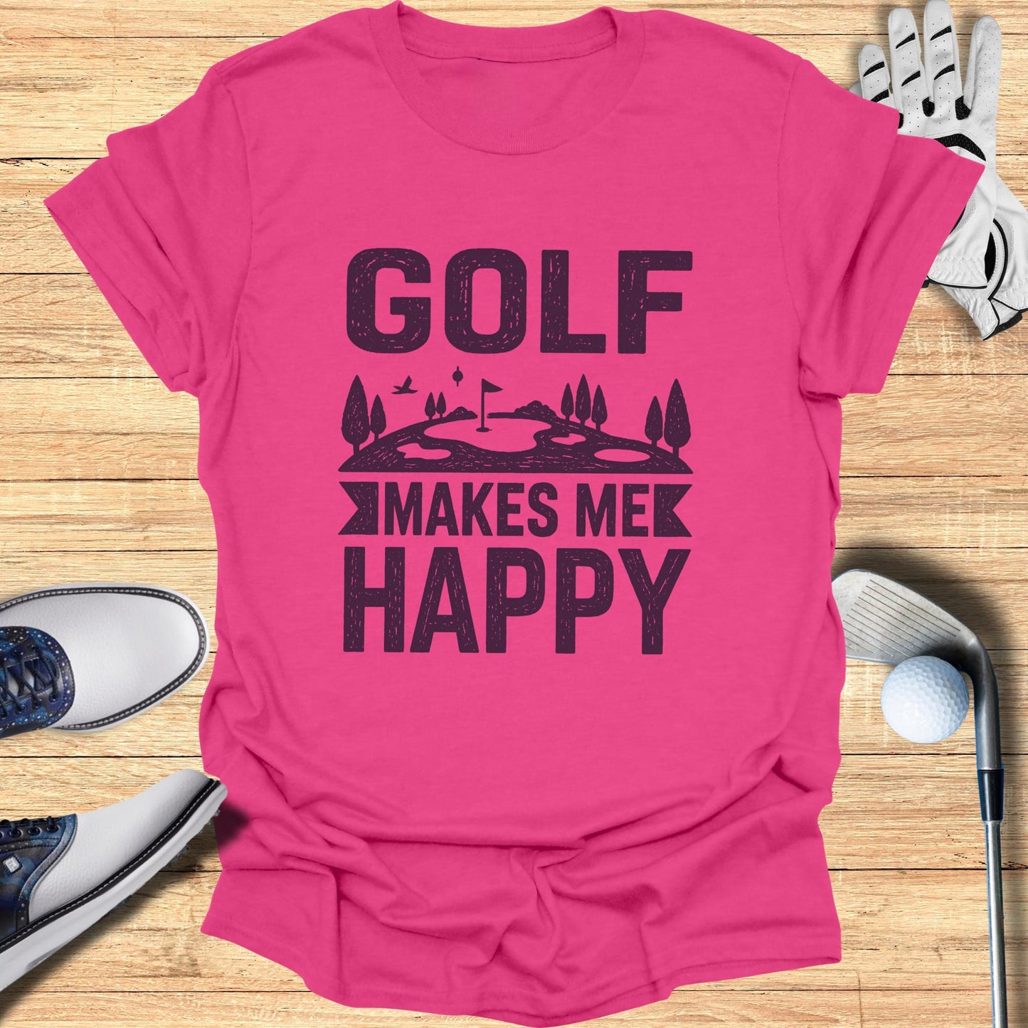 Pink t-shirt with "GOLF MAKES ME HAPPY" text and golf-themed graphic.