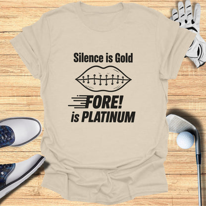 Tan t-shirt with "Silence is Gold, Fore! is Platinum" text and golf accessories.