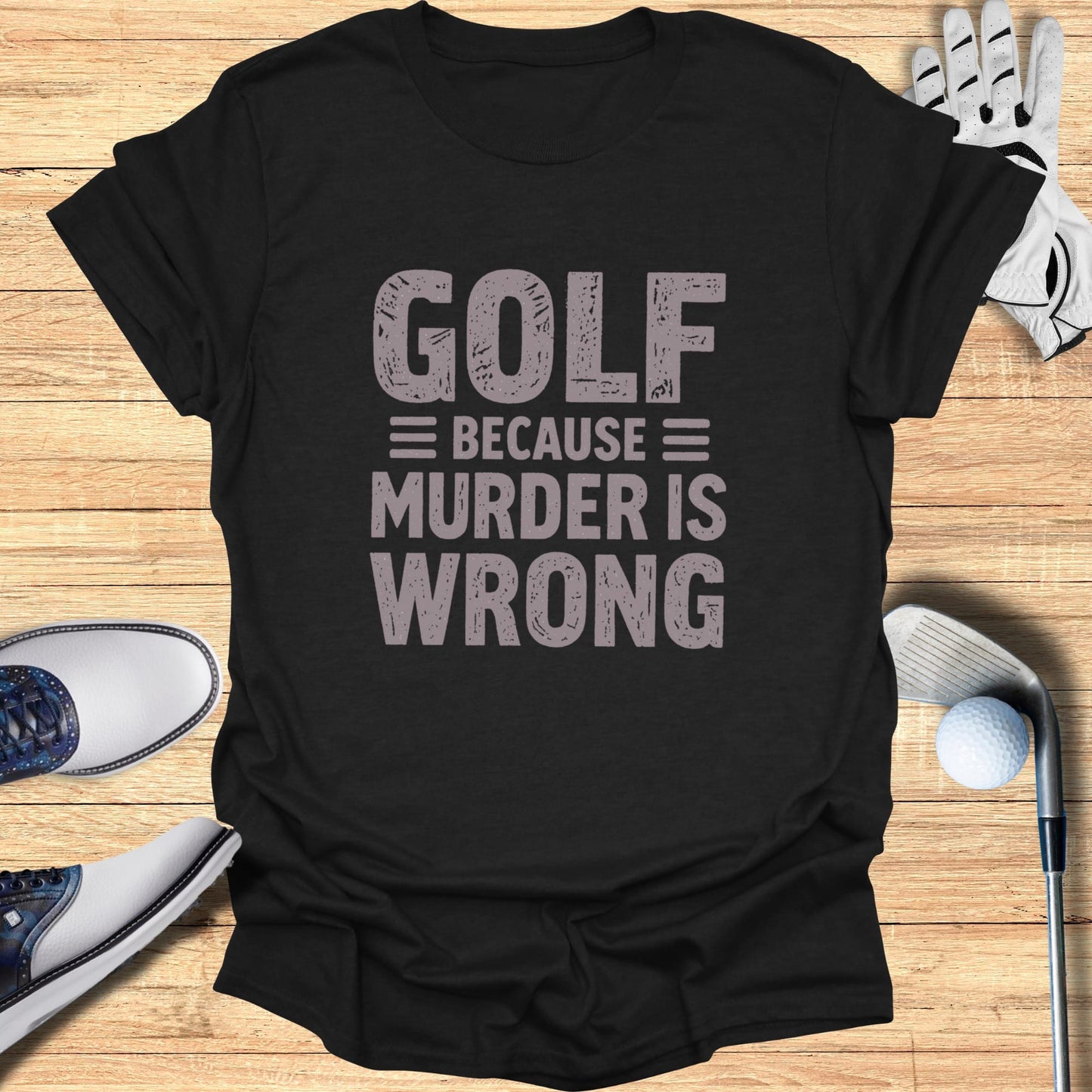 Black t-shirt with "Golf because murder is wrong" text.