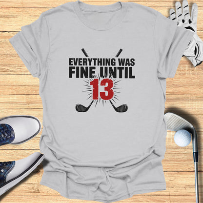 Gray t-shirt with "Everything Was Fine Until 13" graphic and crossed golf clubs.
