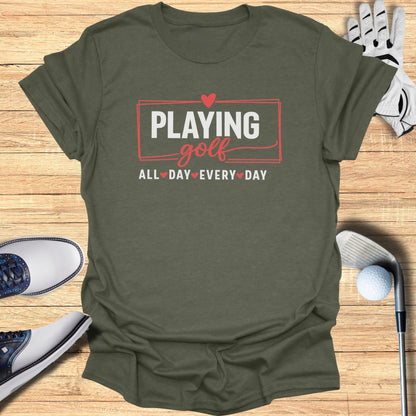 Olive t-shirt with "Playing Golf All Day Every Day" text and golf accessories.