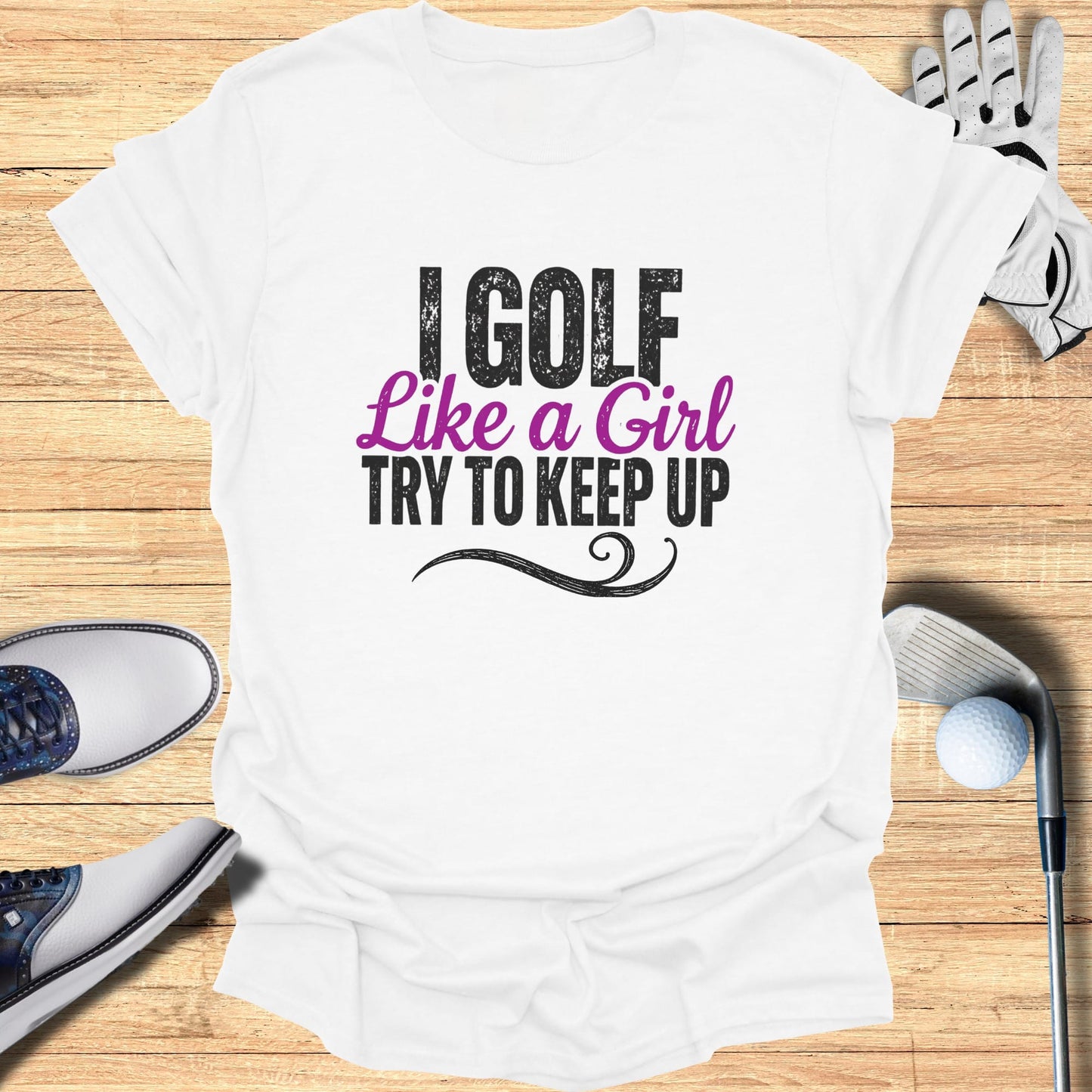 White t-shirt with "I Golf Like a Girl Try to Keep Up" text.