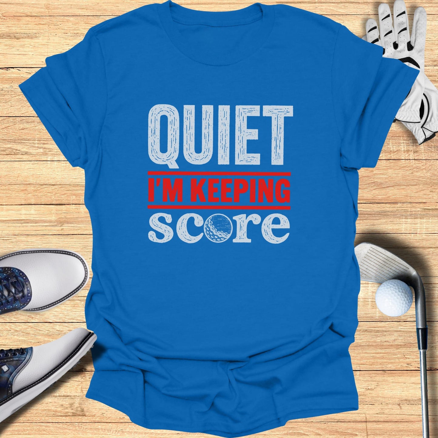 Blue t-shirt with "QUIET I'M KEEPING SCORE" in white and red text.