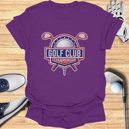 Purple t-shirt with "Golf Club Championship" logo, golf clubs, and ball.