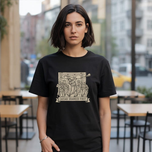 Black t-shirt with "CAESAR SHANKED FIRST" text and a graphic of ancient figures.