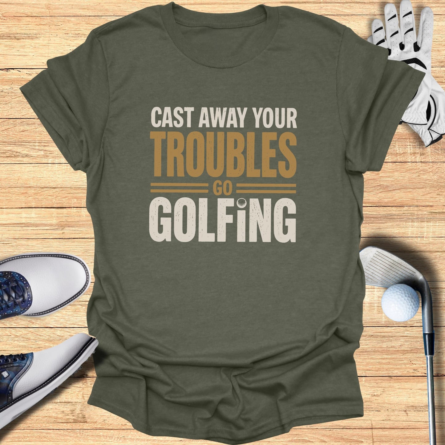 Olive green t-shirt with "Cast Away Your Troubles Golfing" text.