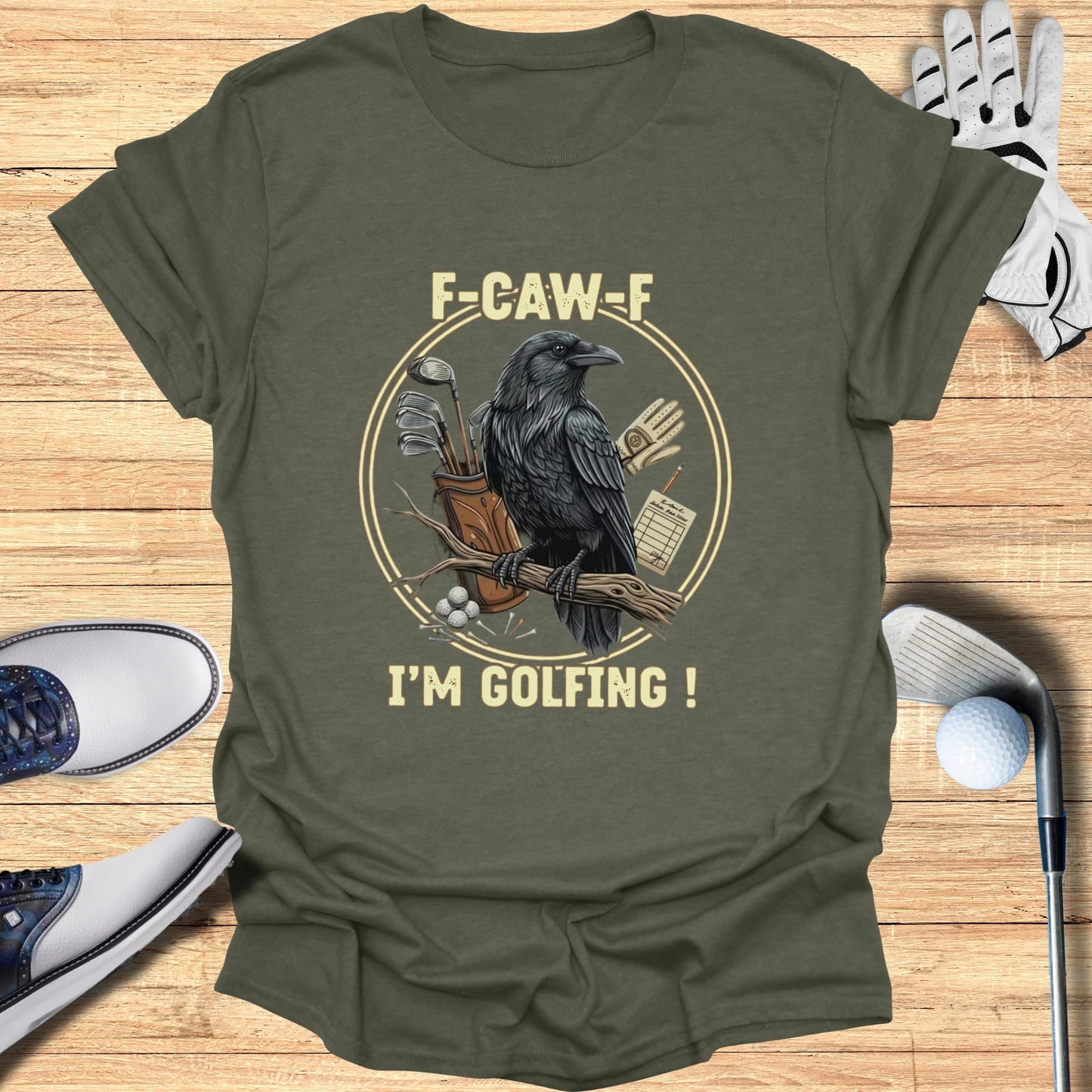 T-shirt with a crow on a branch holding golf clubs, text "F-CAW-F I'M GOLFING!".