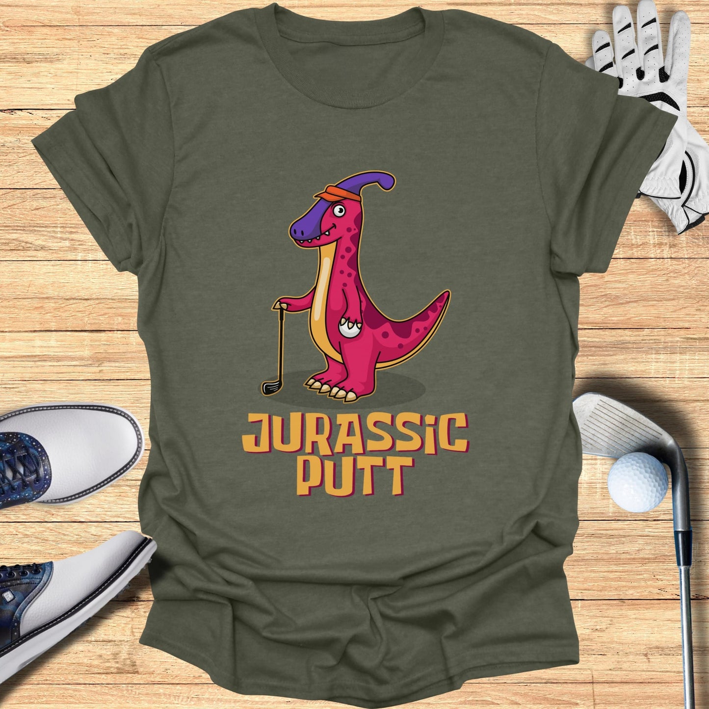 T-shirt with cartoon T-Rex golfer and "Jurassic Putt" text.