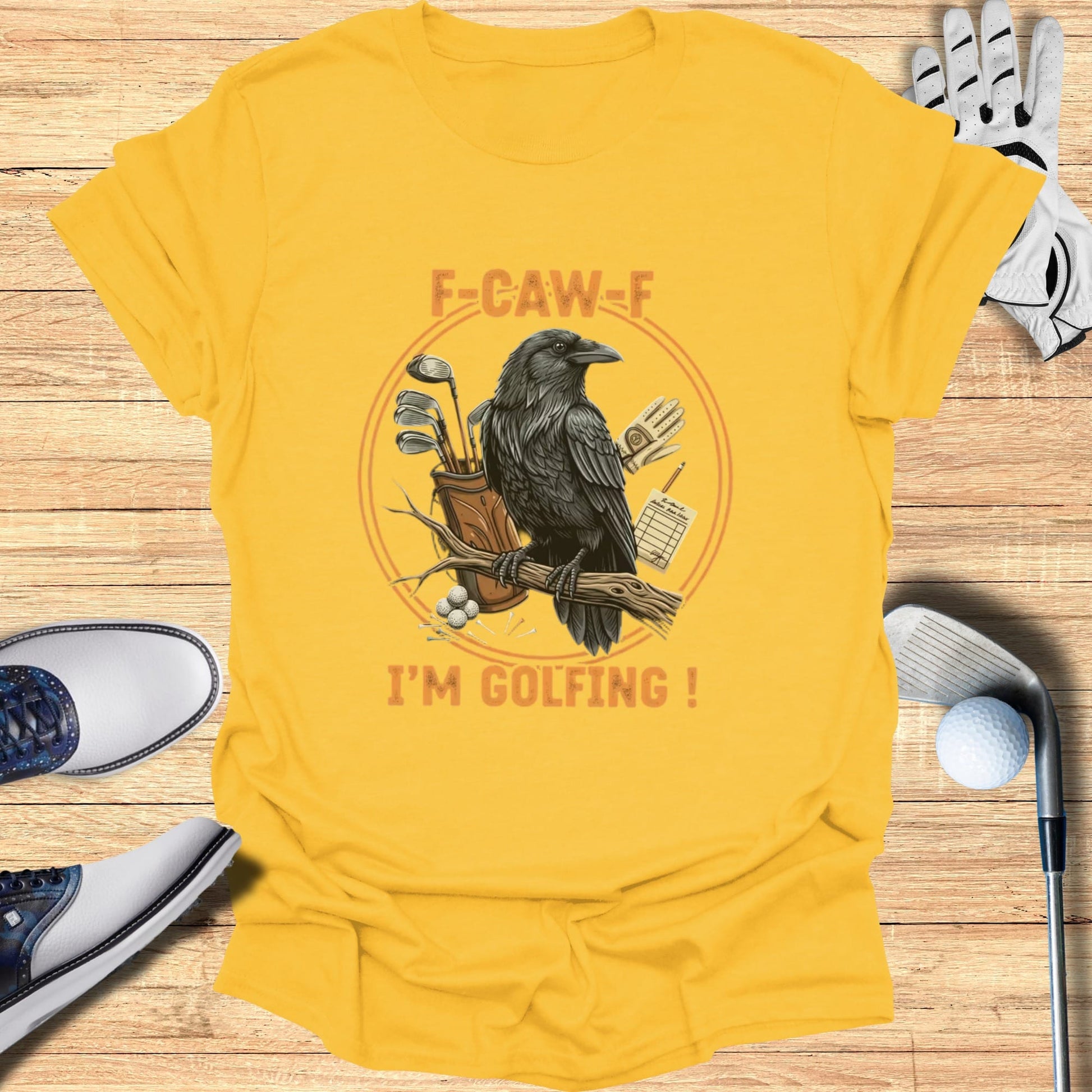 Yellow t-shirt with crow and golf clubs, "F-CAW-F I'M GOLFING!" text.