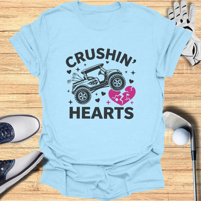Light blue t-shirt with "Crushin' Hearts" text and a golf cart graphic.
