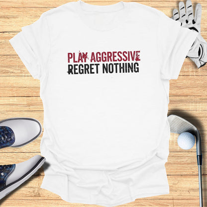 White t-shirt with "PLAY AGGRESSIVE REGRET NOTHING" text, golf club, and shoes.