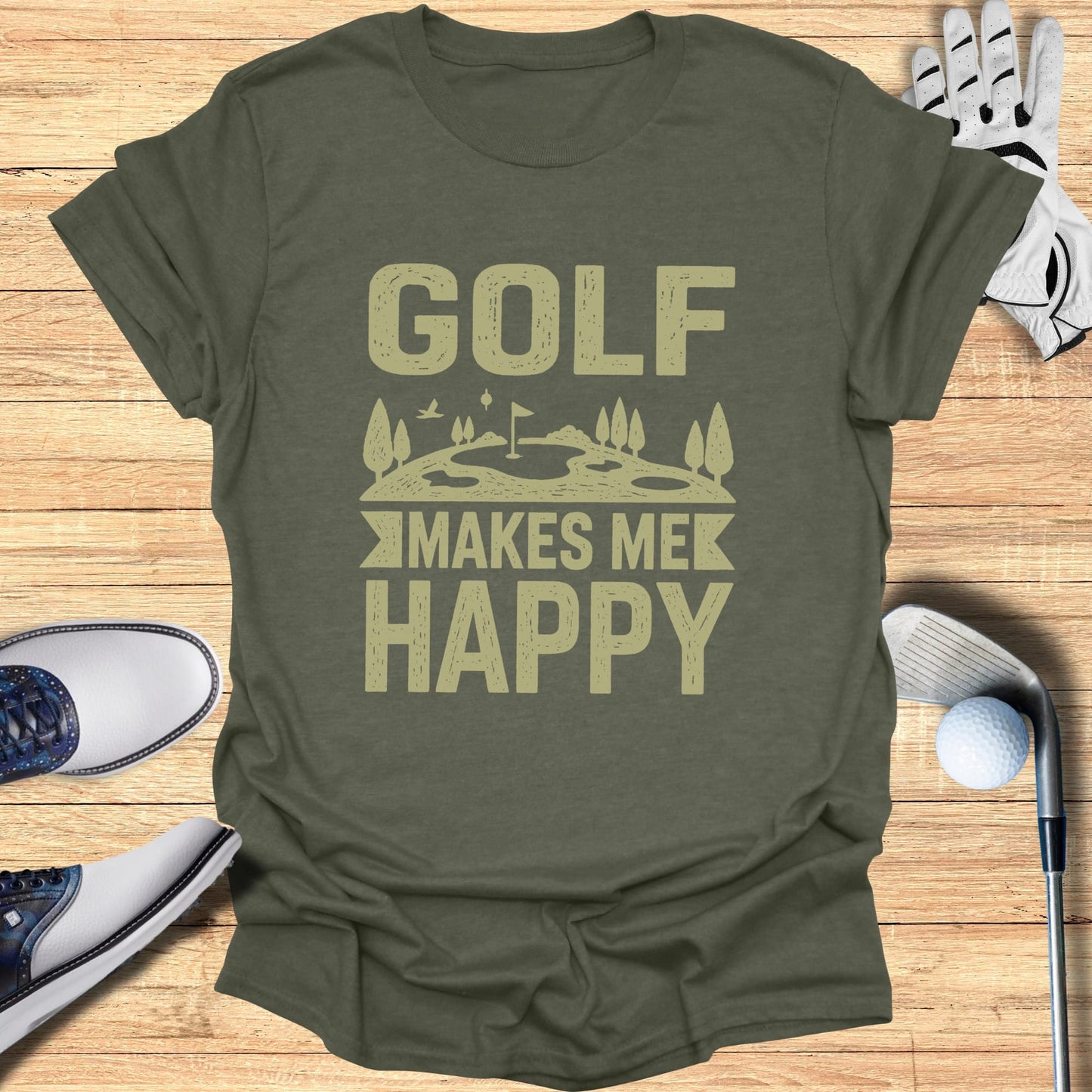 Green t-shirt with "Golf Makes Me Happy" text and golf accessories.