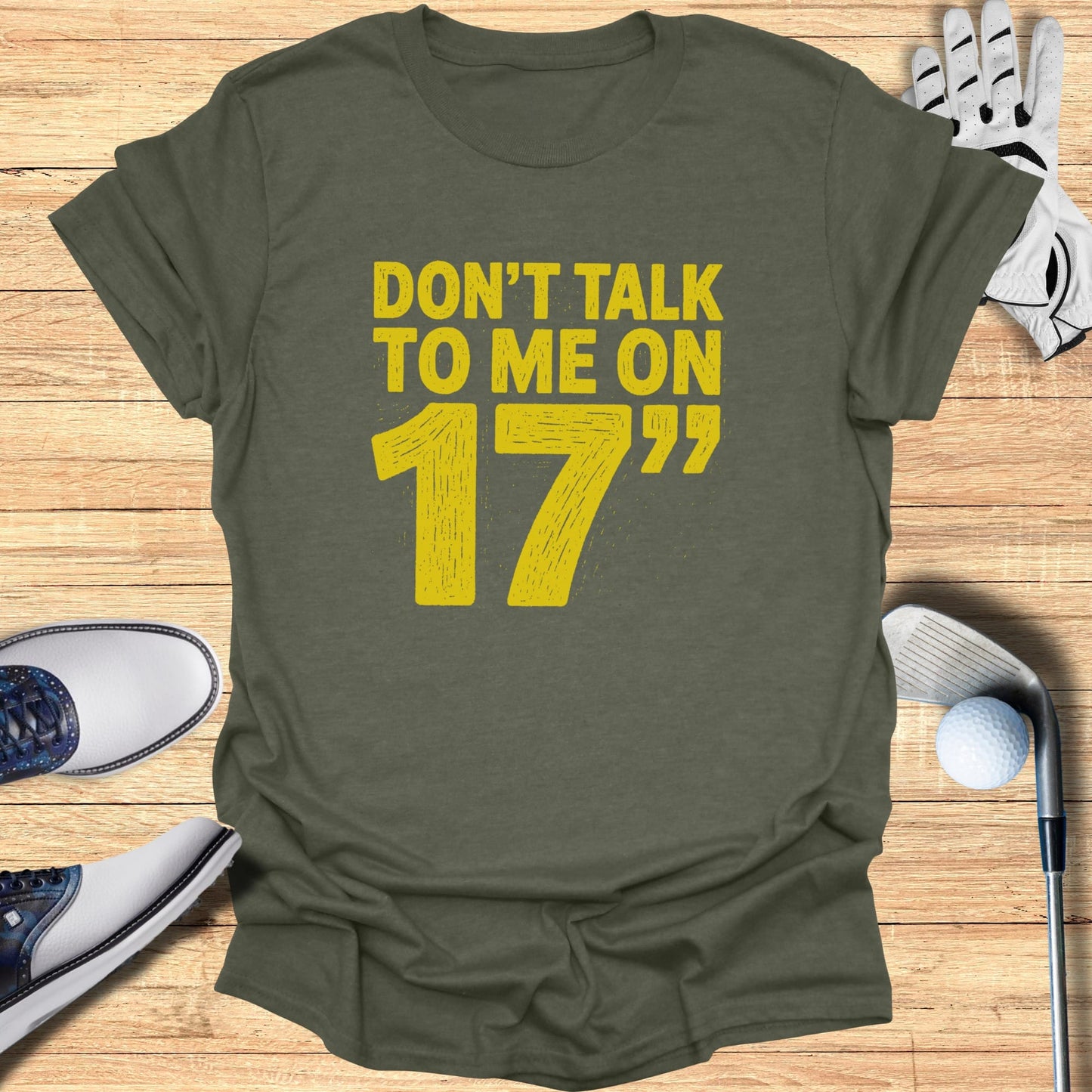 Olive t-shirt with bold yellow text: "DON'T TALK TO ME ON 17".