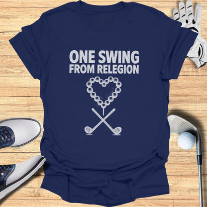 Navy t-shirt with "ONE SWING FROM RELIGION" and a heart of golf balls.