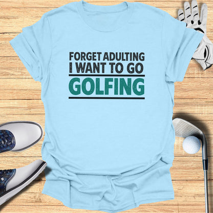 Light blue t-shirt with "Forget Adulting I Want to Go Golfing" text.