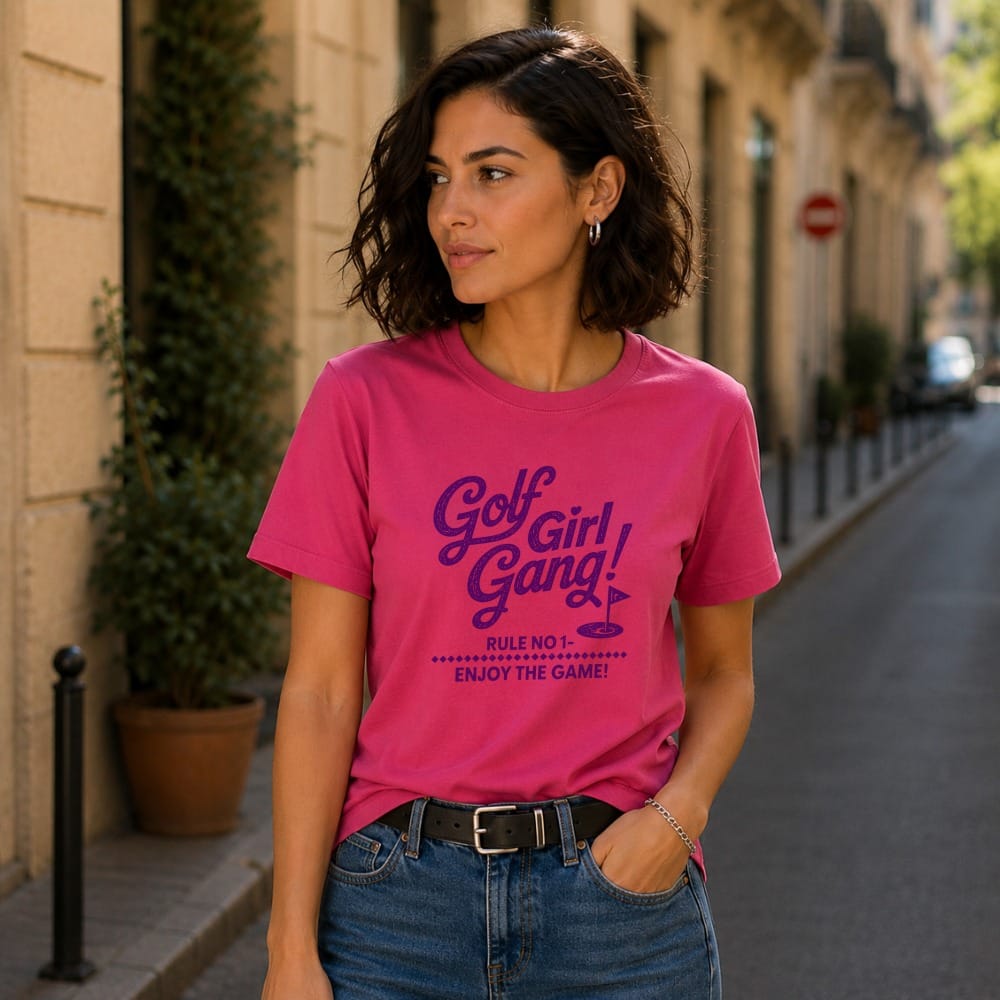 Woman wearing pink t-shirt with "Golf Girl Gang!" text and a golf flag.