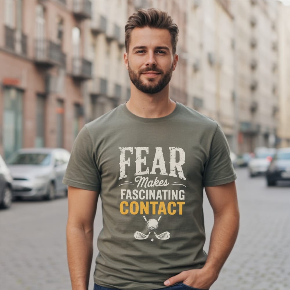 Man wearing a t-shirt with "Fear Makes Fascinating Contact" and golf graphics.