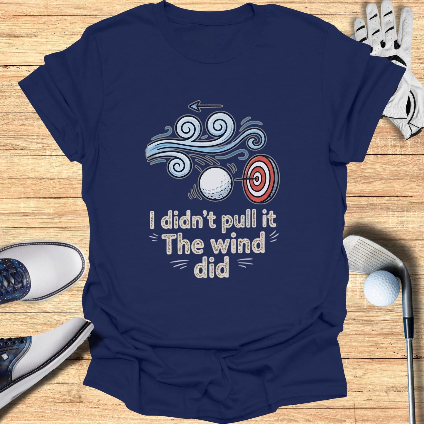 Navy t-shirt with "I didn't pull it The wind did" graphic and golf target.