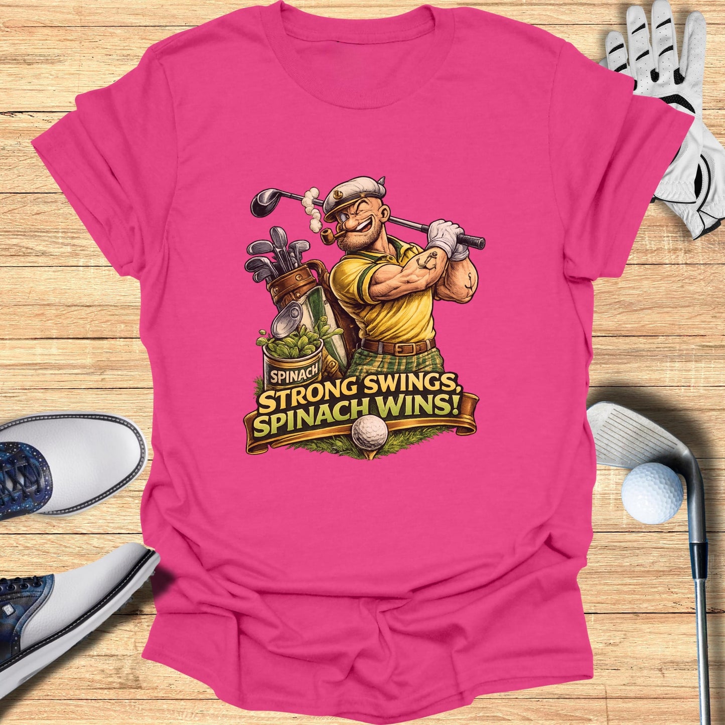 Pink t-shirt with cartoon golfer and text "Spinach, Spinach wins!".