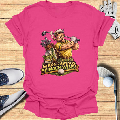 Pink t-shirt with cartoon golfer and text "Spinach, Spinach wins!".