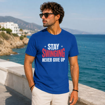 Man wearing a blue t-shirt with "STAY SWINGING NEVER GIVE UP" text.