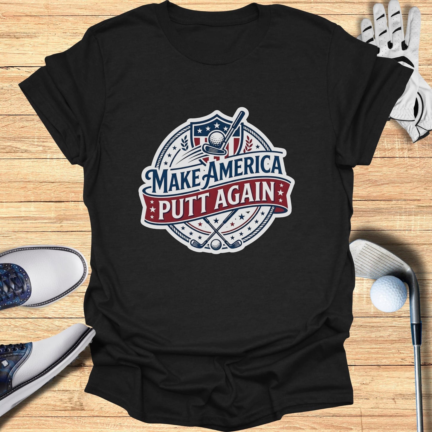 Black t-shirt with "Make America Putt Again" slogan and golf emblems.