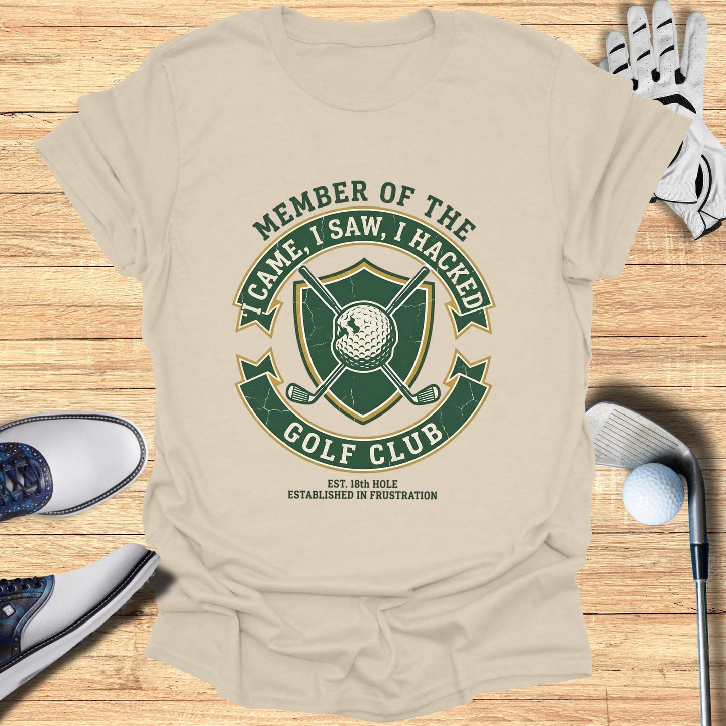 T-shirt with "Member of the Golf Club" crest and golf equipment.
