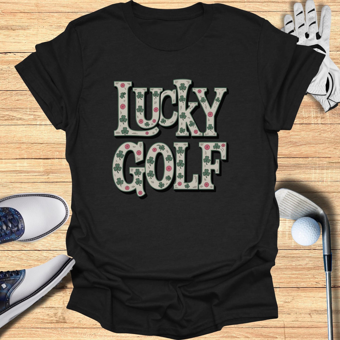 Black t-shirt with "Lucky Golf" text and shamrock and golf ball pattern.