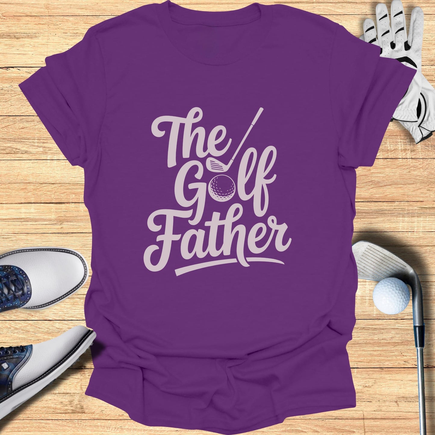 Purple t-shirt with "The Golf Father" text and golf accessories.