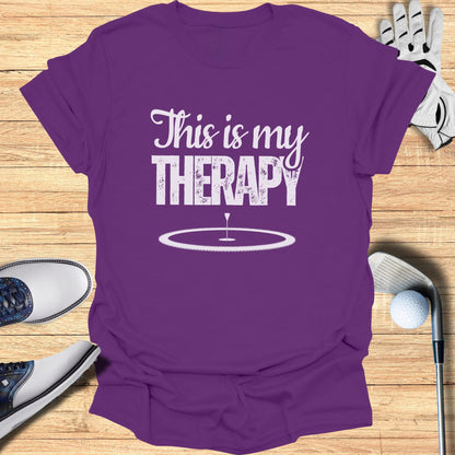 Purple t-shirt with "This is my THERAPY" text and golf imagery.